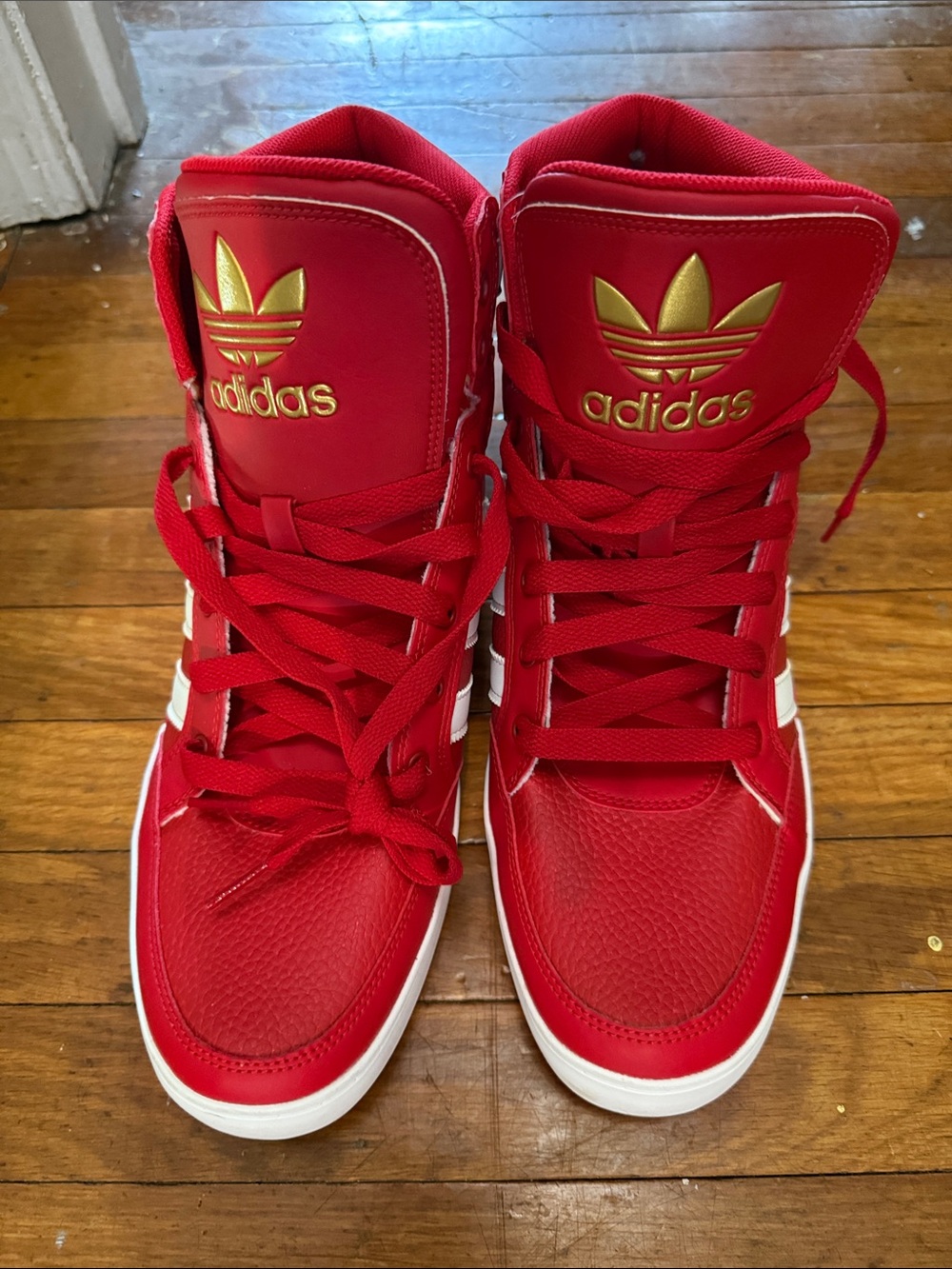 Adidas Red High-Top Sneakers with White Stripes and Gold Logo